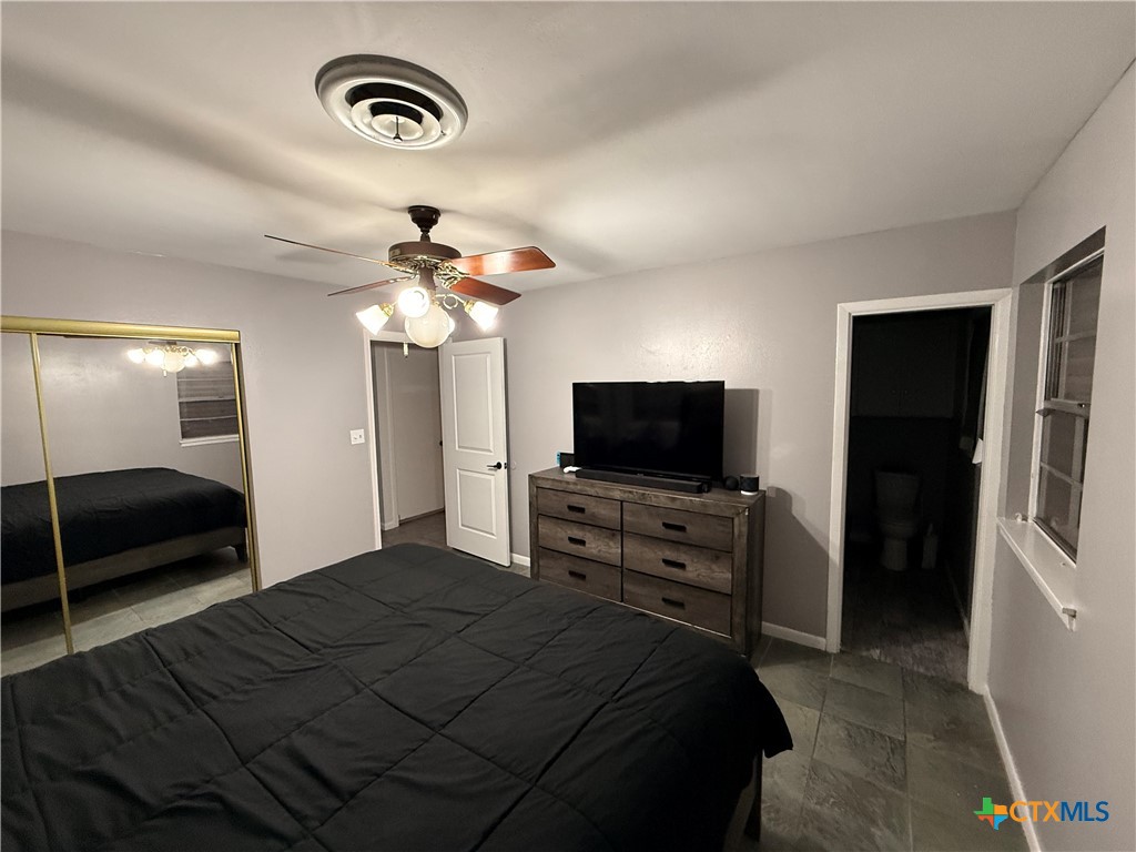 3504 Erwin Avenue Victoria, TX 77901 - Photo 15 of 16 a bedroom with a bed and a flat screen tv