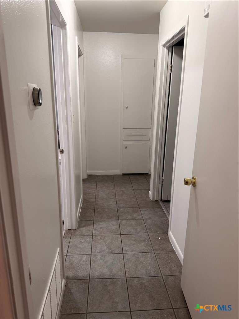 3504 Erwin Avenue Victoria, TX 77901 - Photo 8 of 16 an empty room with a door