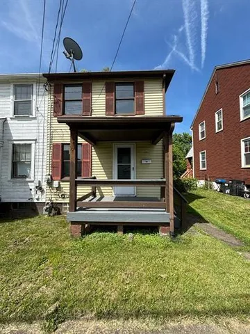 a house view with a garden space