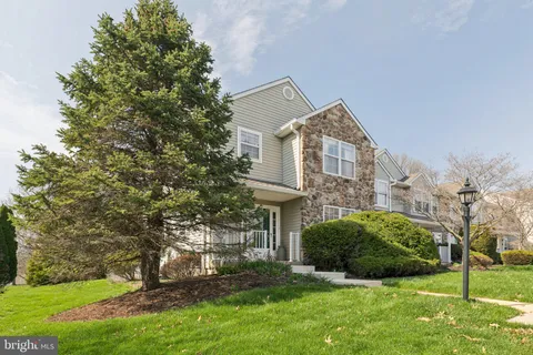 a view of a front of a house with a yard