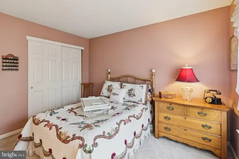 a bedroom with bed and a window