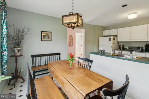 a bath room with a sink and a mirror