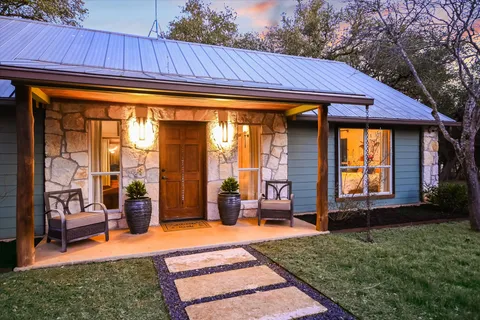 a backyard of a house with seating space