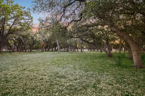 a view of a lake with houses in the background