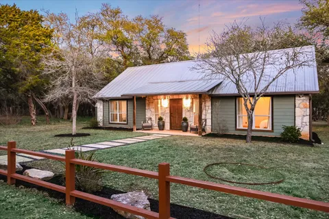 a backyard of a house with seating space