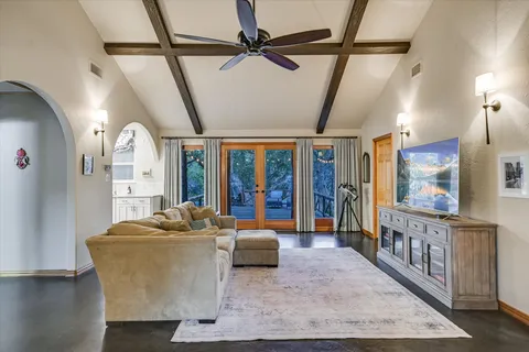 a kitchen with stainless steel appliances granite countertop a sink and a refrigerator