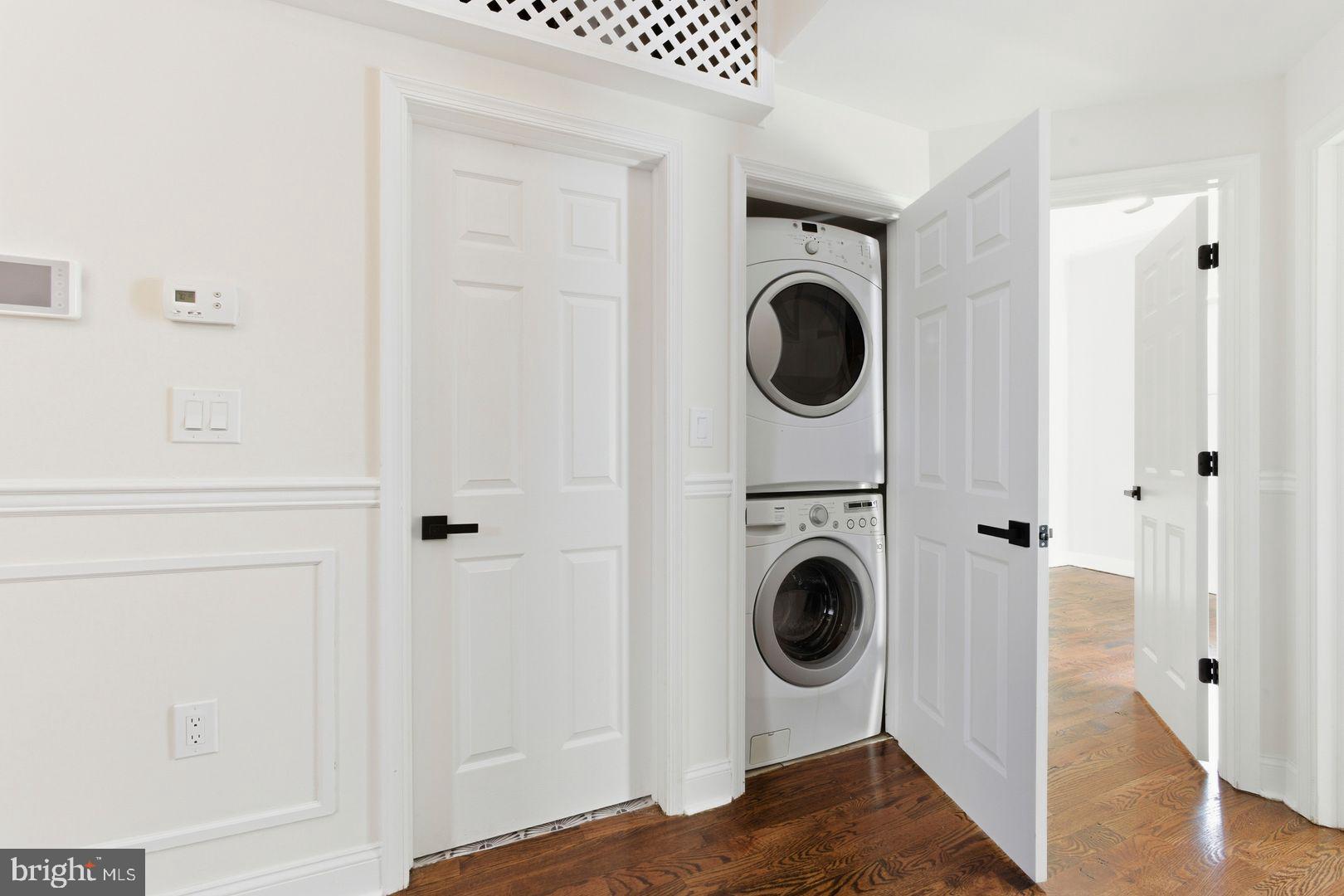 1723-0 Master Street, Unit D Philadelphia, PA 19121 - Photo 15 of 23 a view of a hallway with washer and dryer