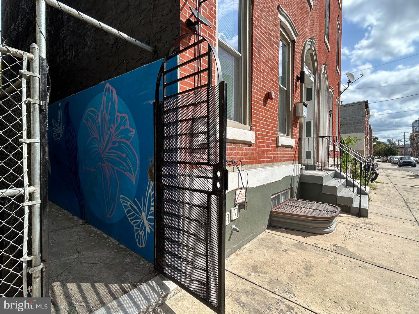 1723-0 Master Street, Unit D Philadelphia, PA 19121 - Photo 20 of 23 a view of a house with a door and wooden walls
