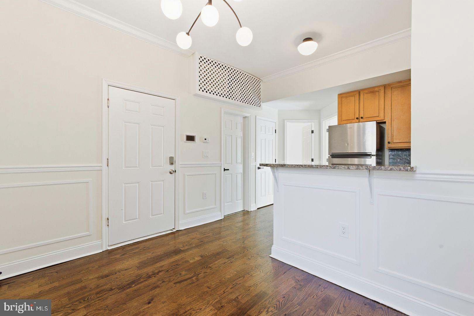 1723-0 Master Street, Unit D Philadelphia, PA 19121 - Photo 5 of 23 a view of a kitchen with wooden floor