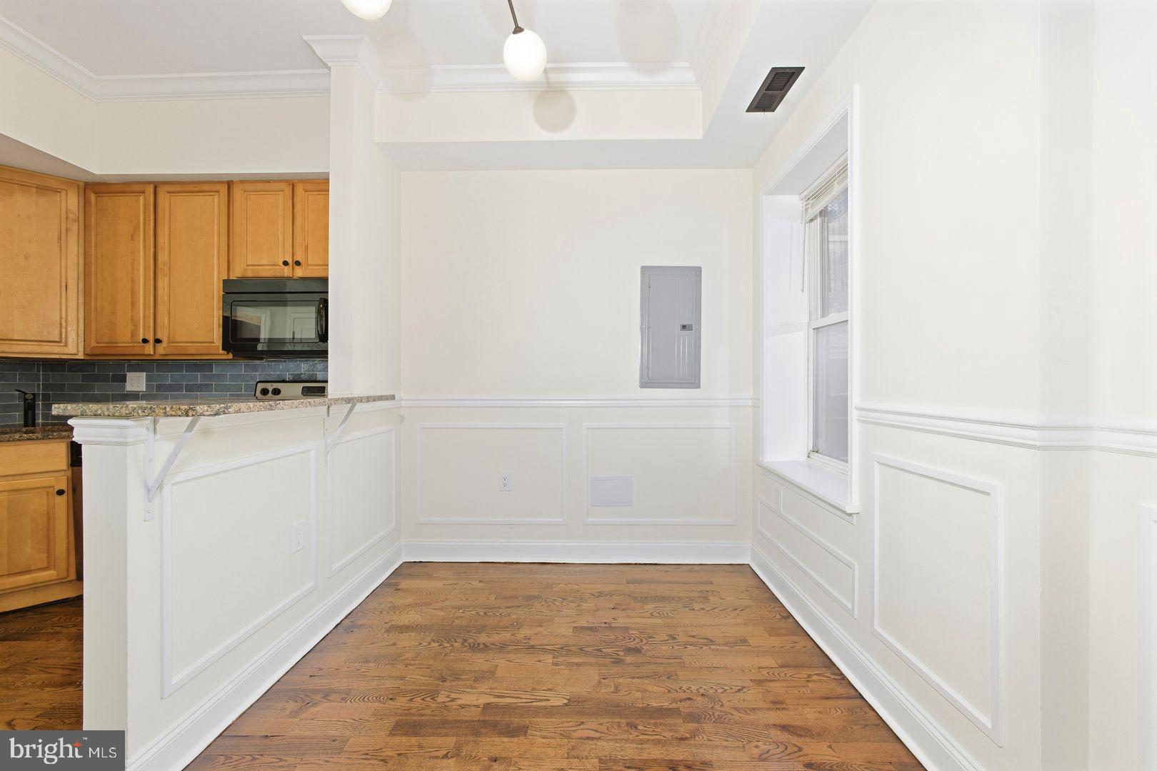 1723-0 Master Street, Unit D Philadelphia, PA 19121 - Photo 6 of 23 a view of a refrigerator with cabinets
