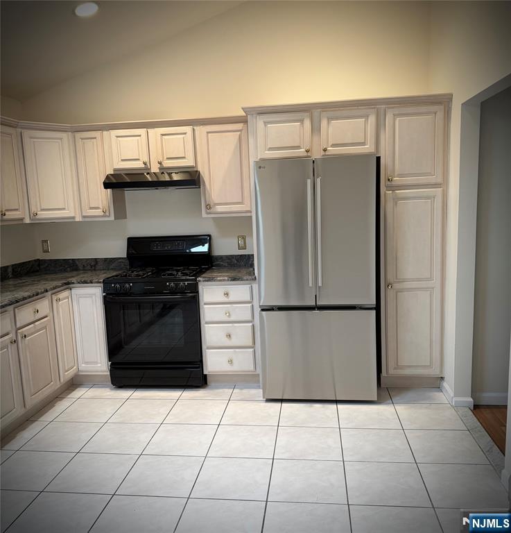 405 Chestnut Street, Unit 1 Ridgefield, NJ 07657 - Photo 16 of 24 a kitchen with stainless steel appliances a refrigerator and a stove