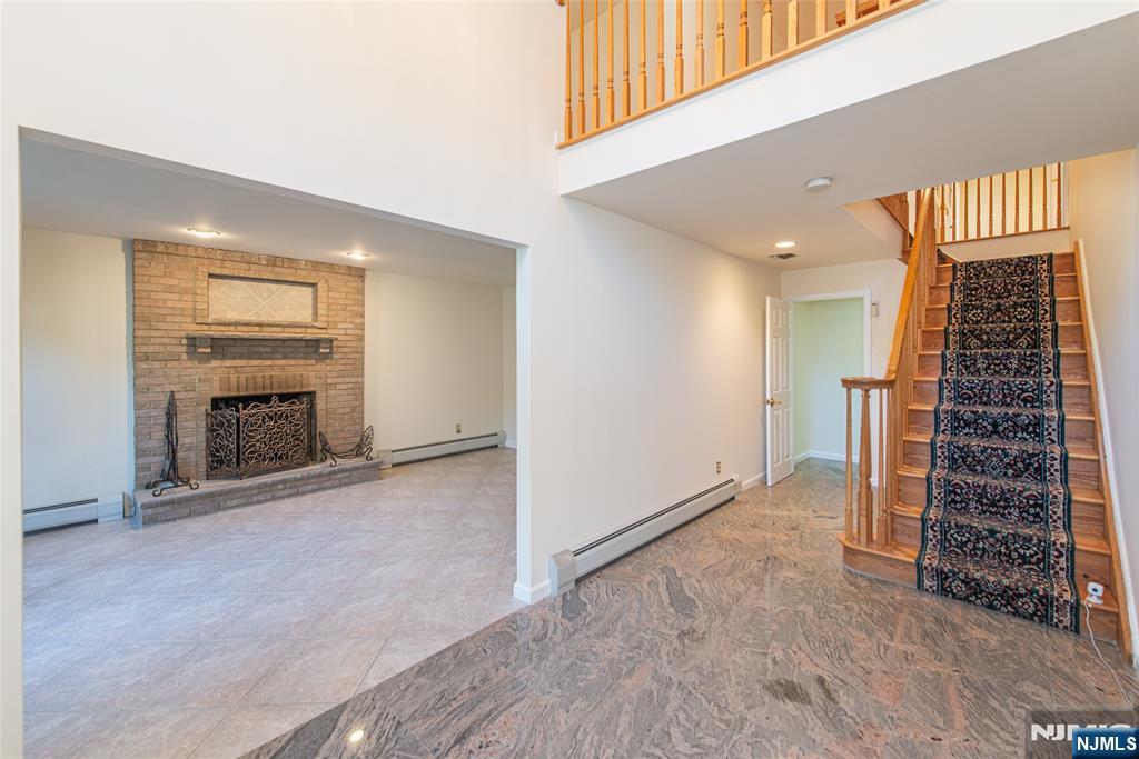 405 Chestnut Street, Unit 1 Ridgefield, NJ 07657 - Photo 7 of 24 an entryway and livingroom with furniture