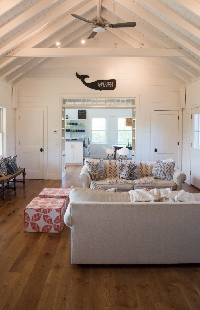 146 Surfside Road Nantucket, MA 02554 - Photo 15 of 43 a living room with furniture and a chandelier
