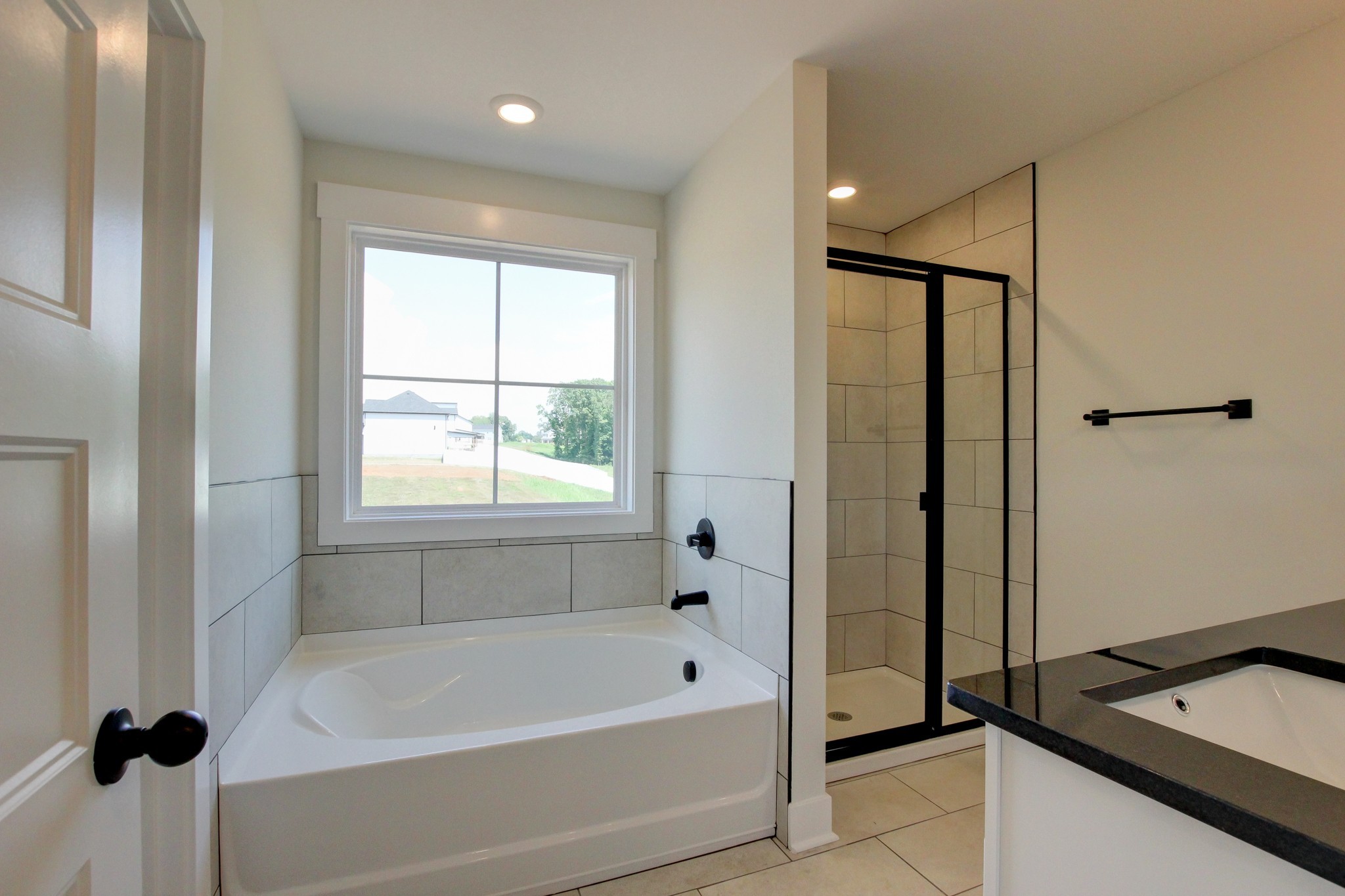 1244 Boulder Pass Road Clarksville, TN 37040 - Photo 17 of 31 a bathroom with a bathtub and a shower