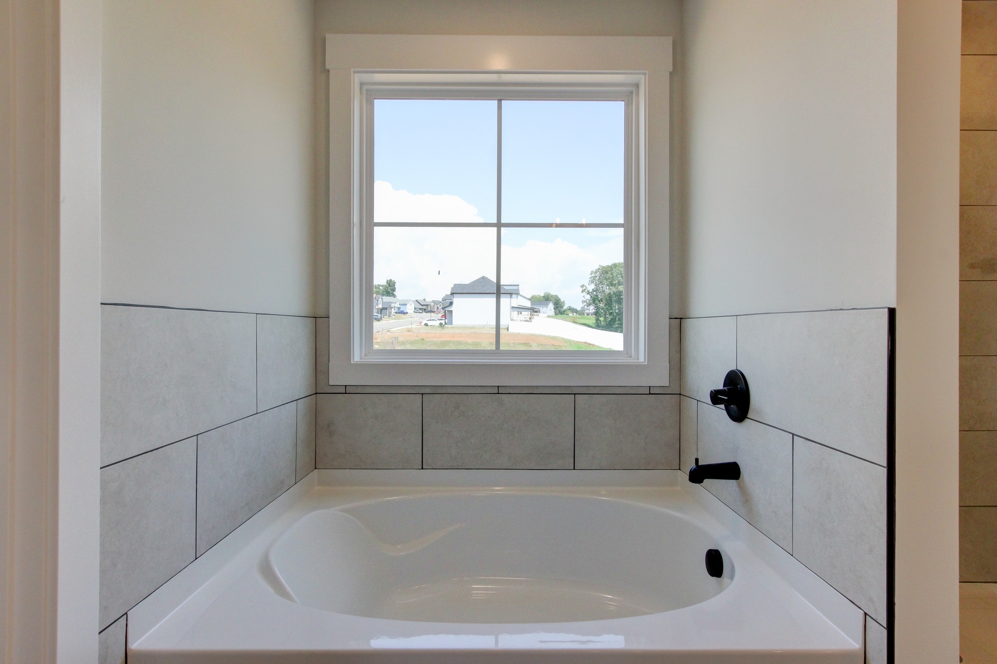 1244 Boulder Pass Road Clarksville, TN 37040 - Photo 18 of 31 a white bath tub sitting next to a window