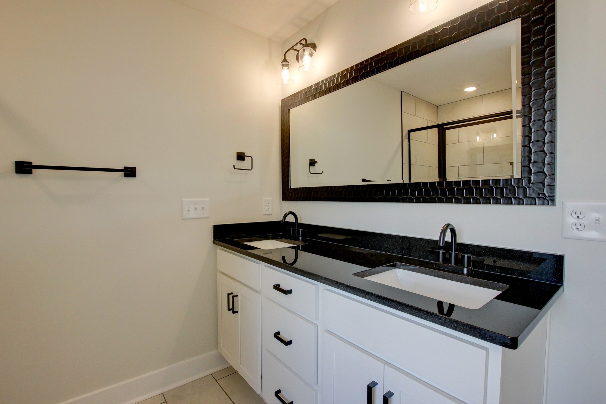 1244 Boulder Pass Road Clarksville, TN 37040 - Photo 19 of 31 a close view of a sink a mirror and a vanity in the bathroom