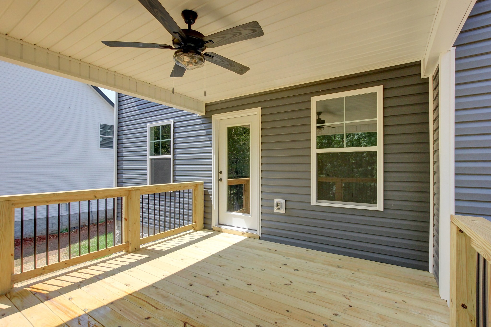 1244 Boulder Pass Road Clarksville, TN 37040 - Photo 30 of 31 a view of a deck with wooden floor and a ceiling fan