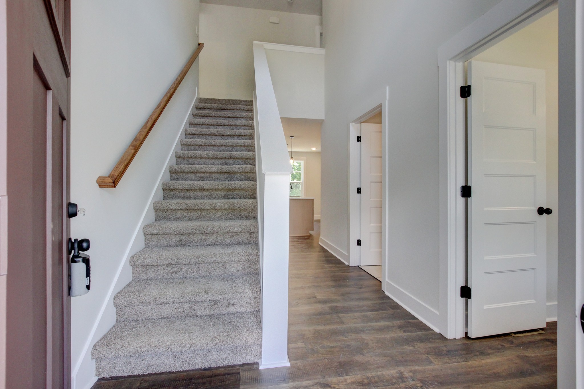 1244 Boulder Pass Road Clarksville, TN 37040 - Photo 4 of 31 a view of an entryway with wooden floor and staircase