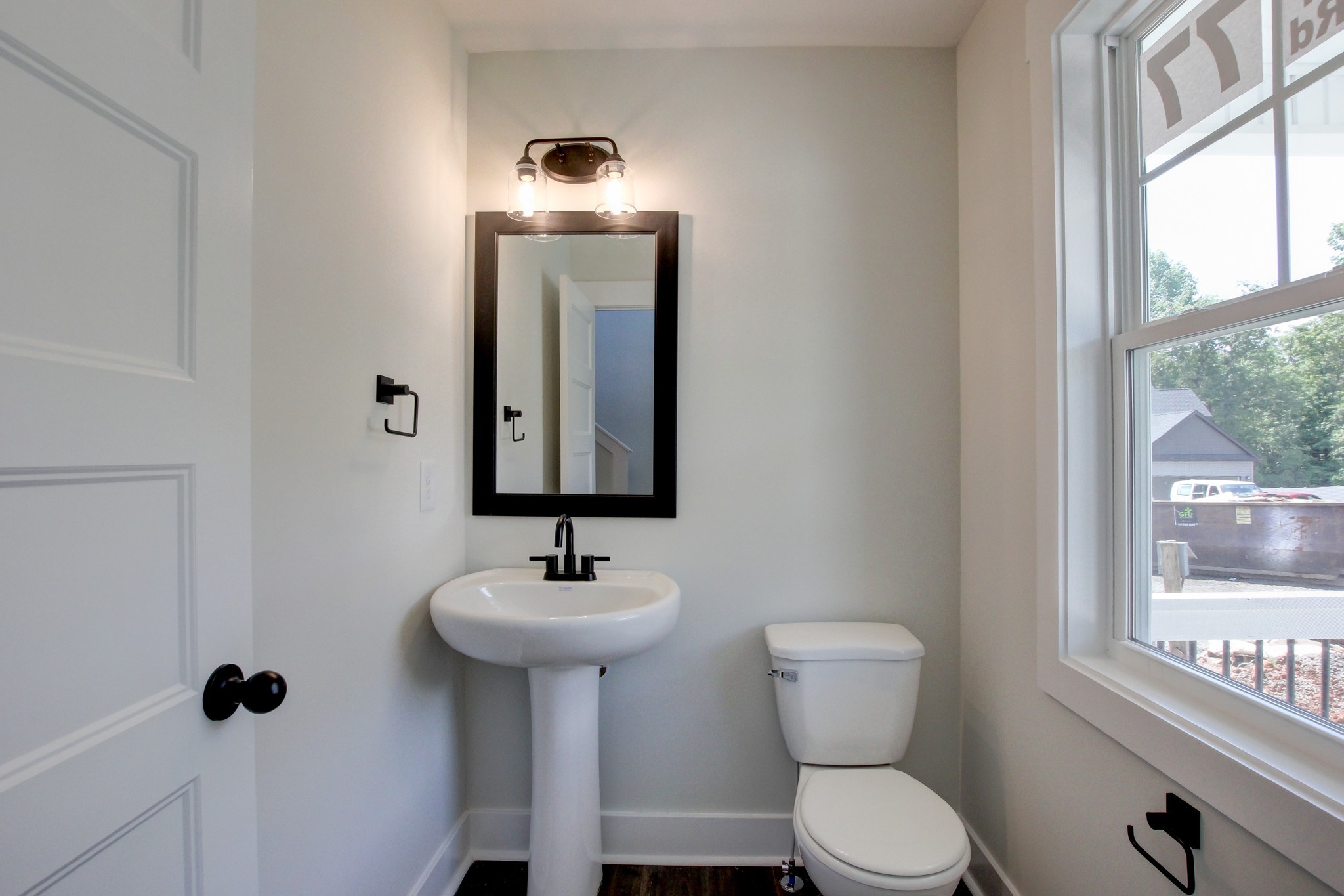 1244 Boulder Pass Road Clarksville, TN 37040 - Photo 5 of 31 a bathroom with a toilet sink and mirror
