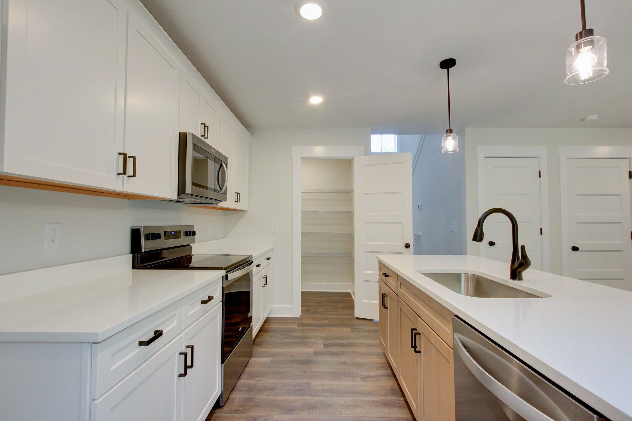 1244 Boulder Pass Road Clarksville, TN 37040 - Photo 8 of 31 a kitchen with stainless steel appliances a sink stove and refrigerator