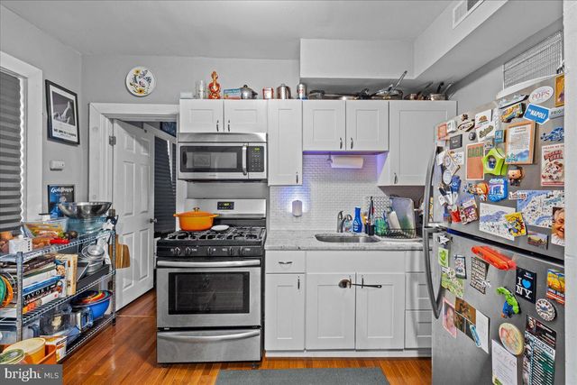 a bathroom with a toilet a sink and a mirror
