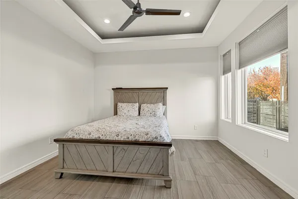 a bathroom with a tub and mirror