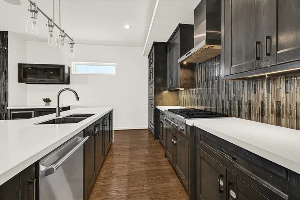 a bathroom with double sink and a mirror