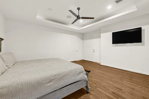 a view of hallway with stairs and wooden floor