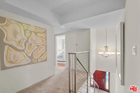 a bedroom with bed and wooden floor