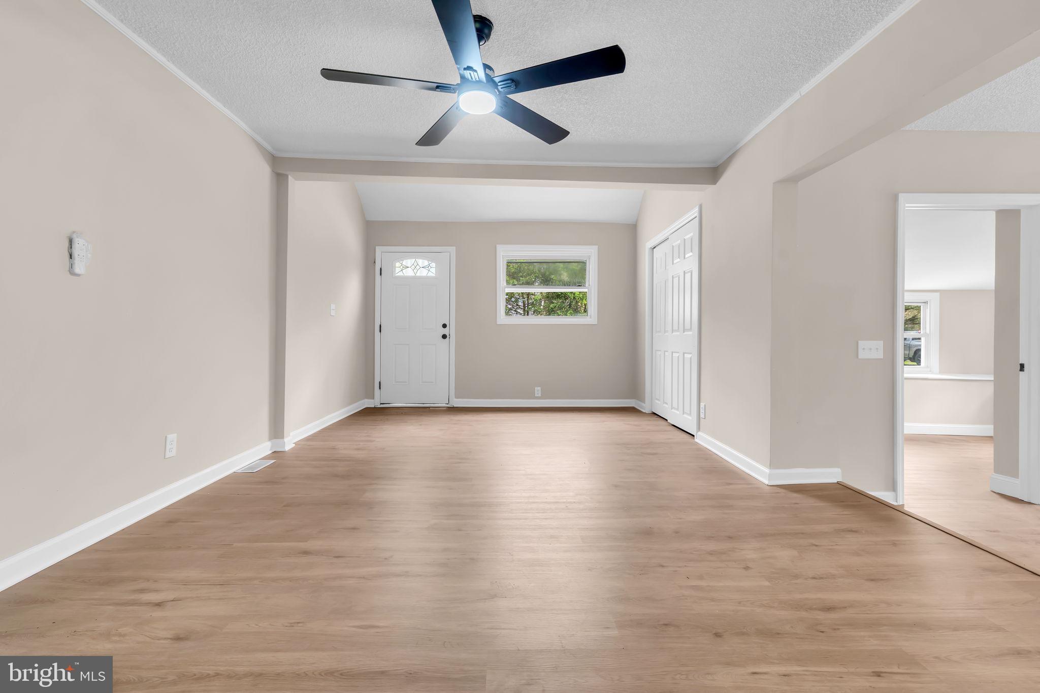 2438 Range Road Browns Mills, NJ 08015 - Photo 11 of 61 wooden floor in an empty room with a window