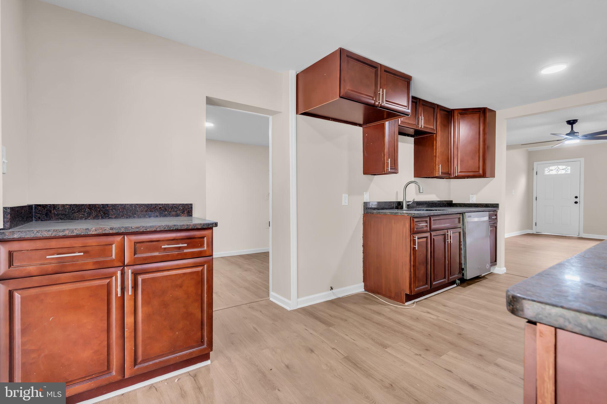 2438 Range Road Browns Mills, NJ 08015 - Photo 17 of 61 an open kitchen with wooden floor and electronic appliances