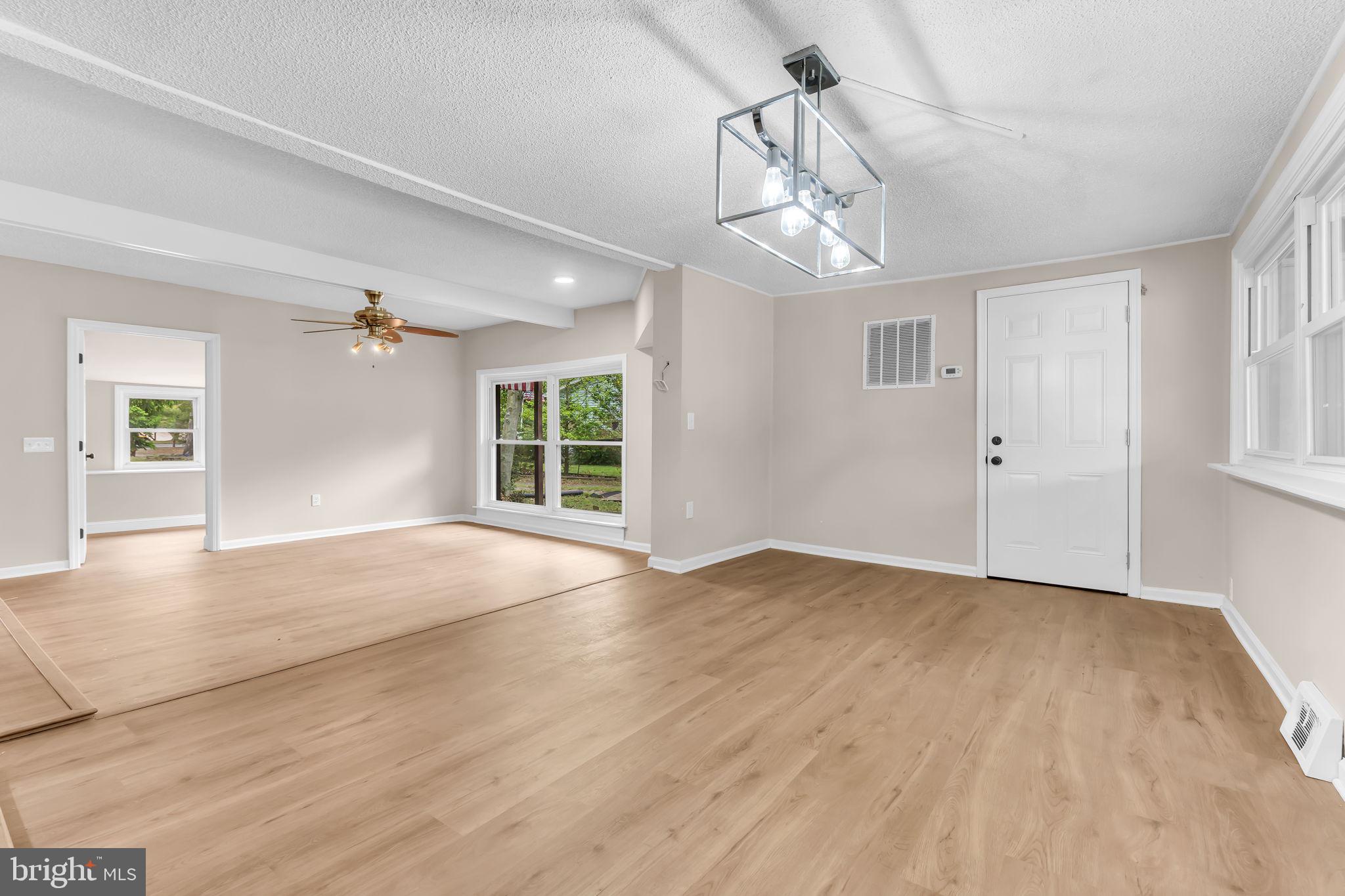 2438 Range Road Browns Mills, NJ 08015 - Photo 19 of 61 a view of an empty room with a window and wooden floor