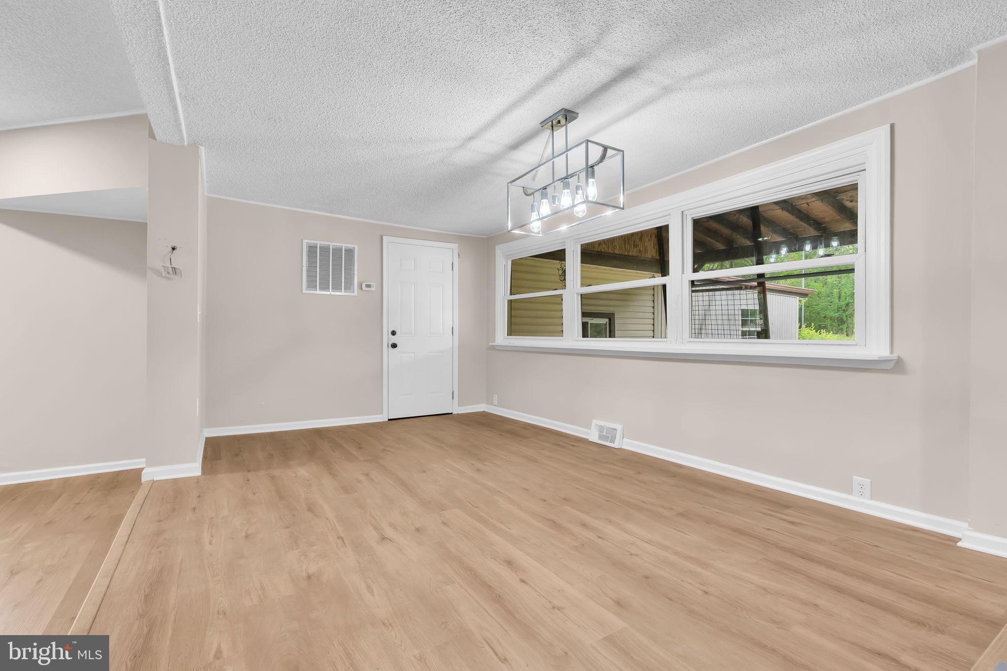 2438 Range Road Browns Mills, NJ 08015 - Photo 21 of 61 a view of empty room with wooden floor and fan