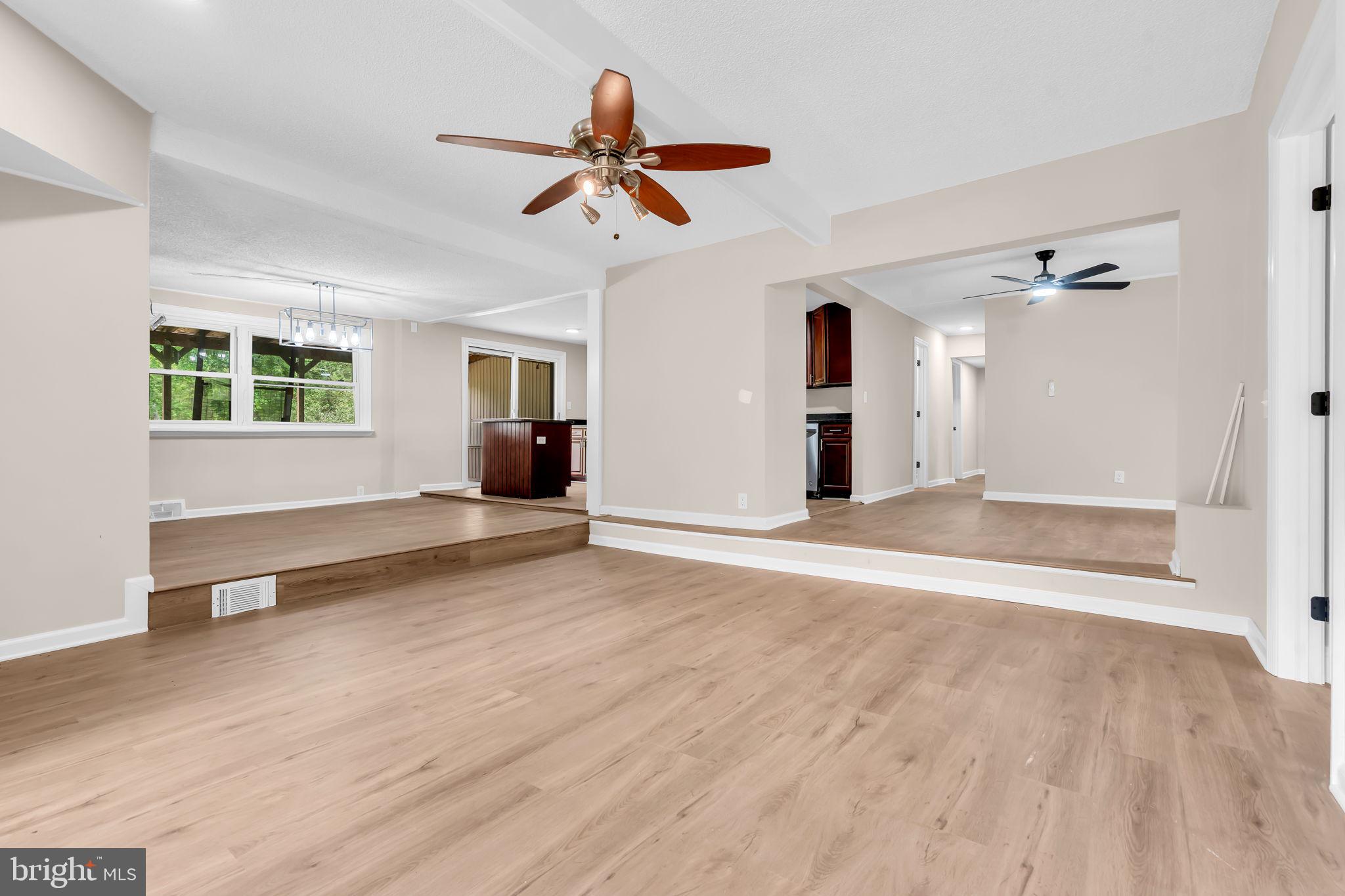 2438 Range Road Browns Mills, NJ 08015 - Photo 22 of 61 a view of empty room with wooden floor and fan