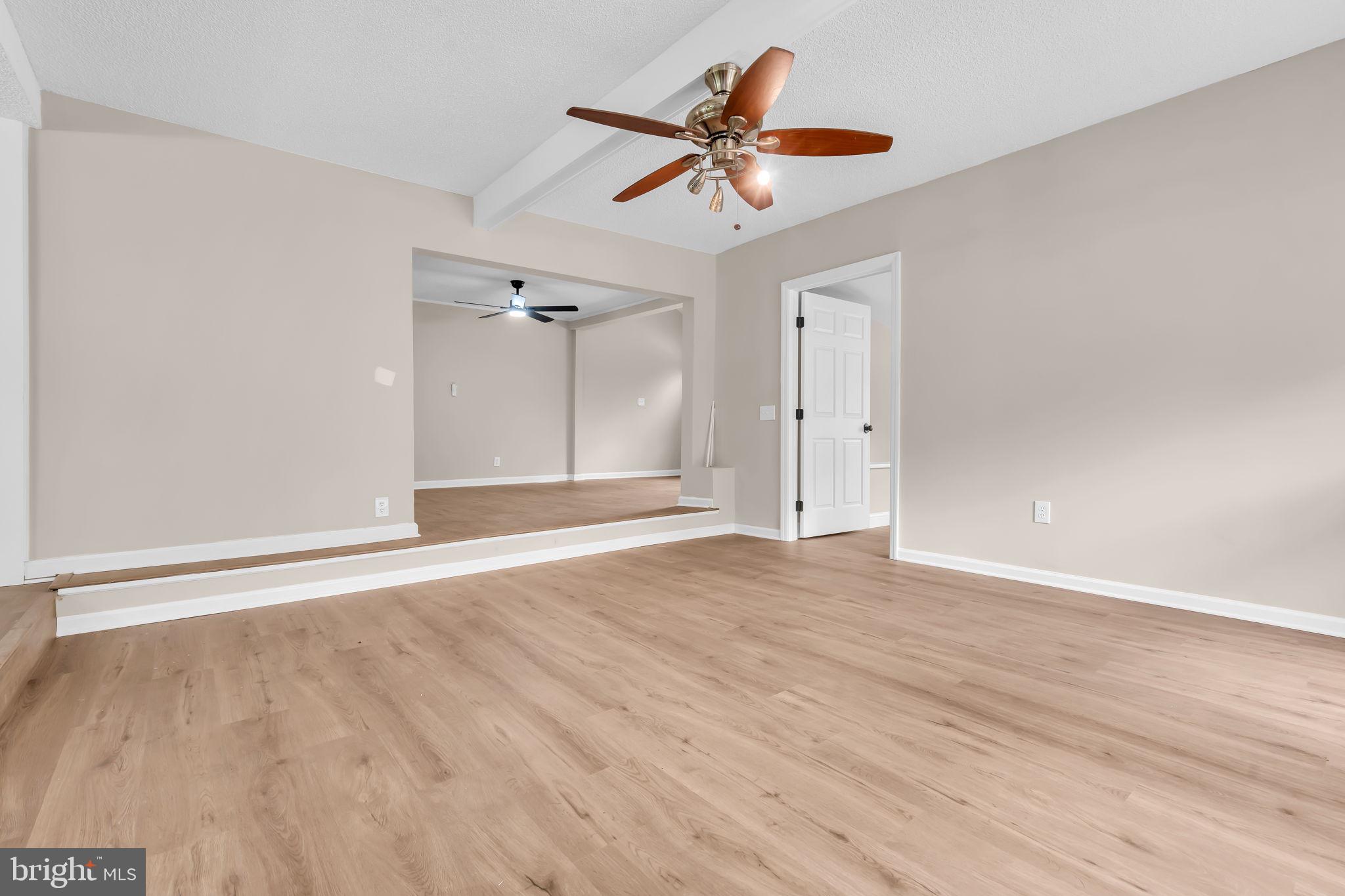 2438 Range Road Browns Mills, NJ 08015 - Photo 25 of 61 a view of empty room with wooden floor and ceiling fan