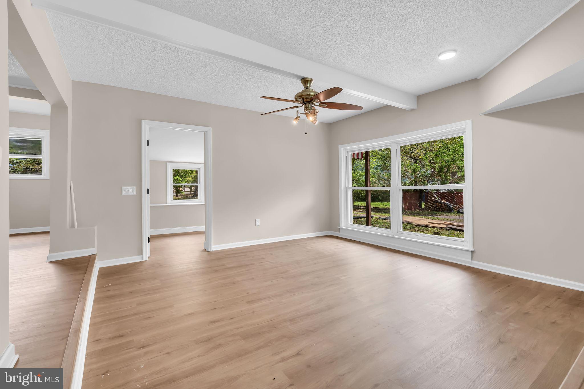 2438 Range Road Browns Mills, NJ 08015 - Photo 27 of 61 a view of an empty room with a window and wooden floor