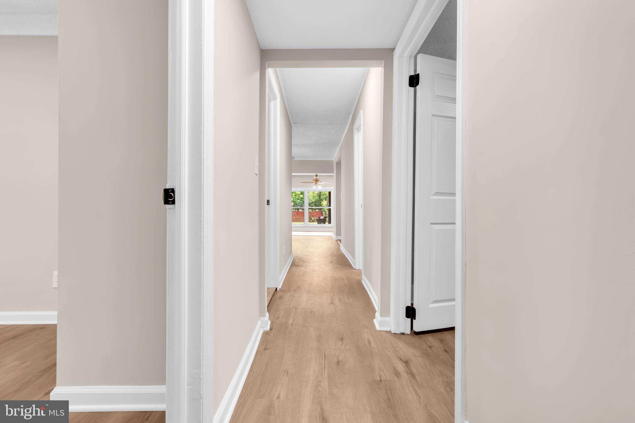 2438 Range Road Browns Mills, NJ 08015 - Photo 33 of 61 a view of a hallway with wooden floor