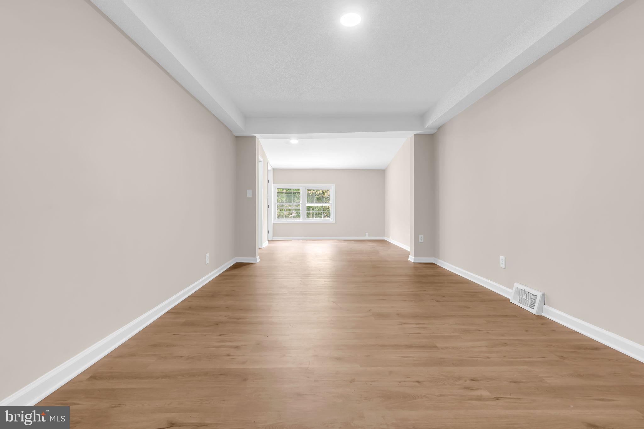 2438 Range Road Browns Mills, NJ 08015 - Photo 34 of 61 an empty room with wooden floor and windows