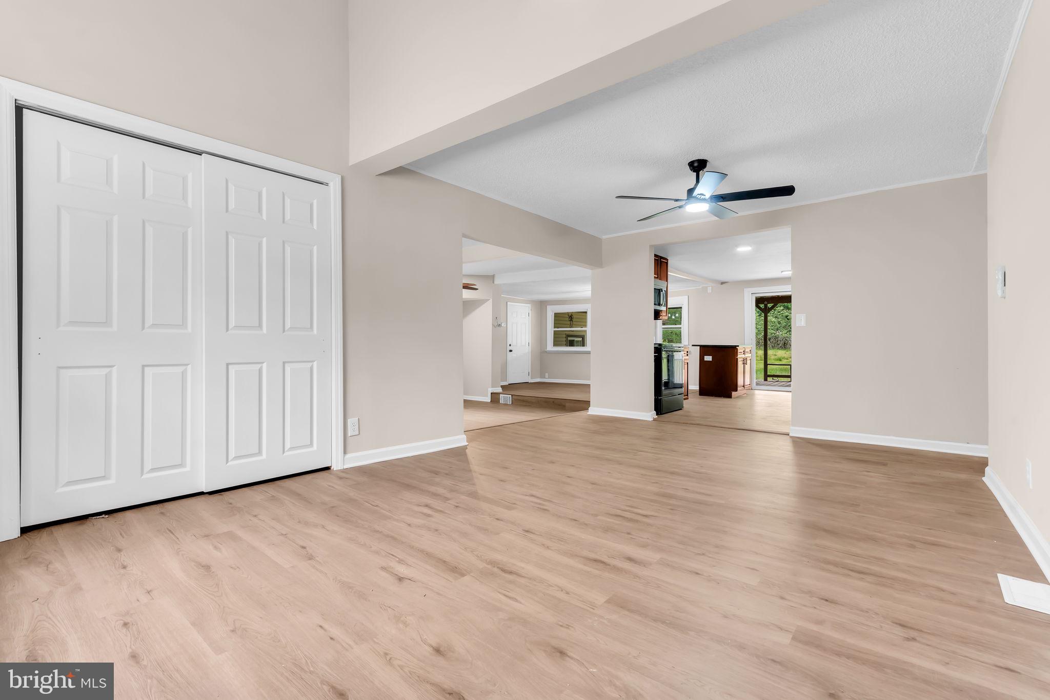 2438 Range Road Browns Mills, NJ 08015 - Photo 8 of 61 an empty room with wooden floor ceiling fan