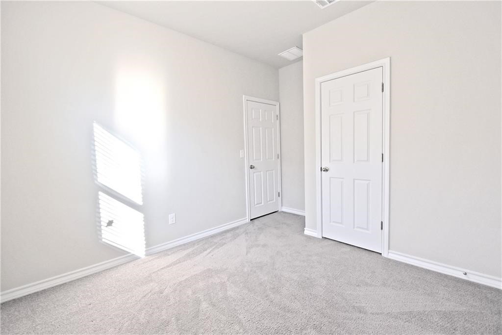 1220 Natchez Trail Leander, TX 78641 - Photo 8 of 13 an empty room with windows