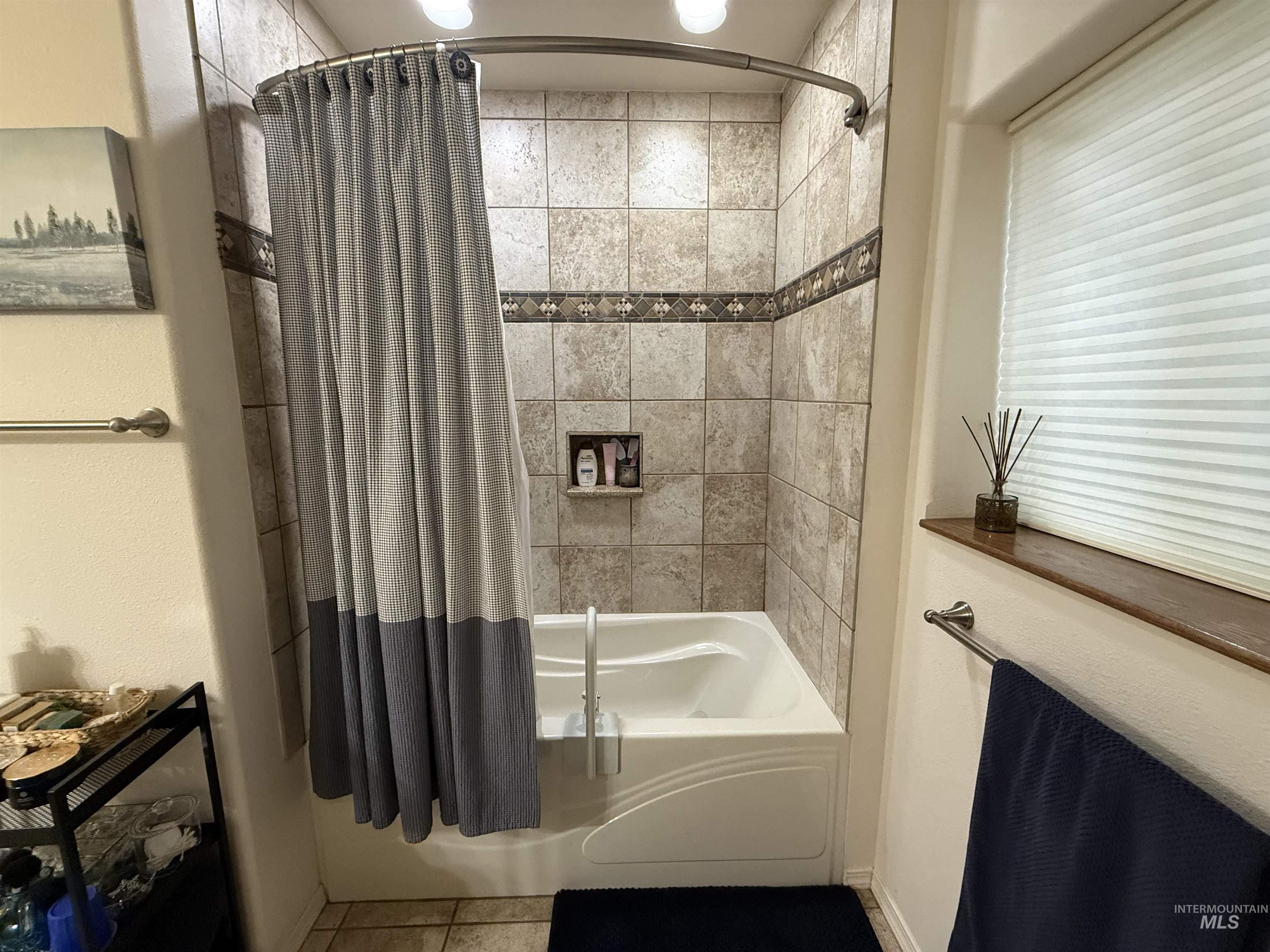 1653 Kidder Ridge Road Kamiah, ID 83536 - Photo 12 of 47 Bathroom with shower / tub combo and tile patterned flooring