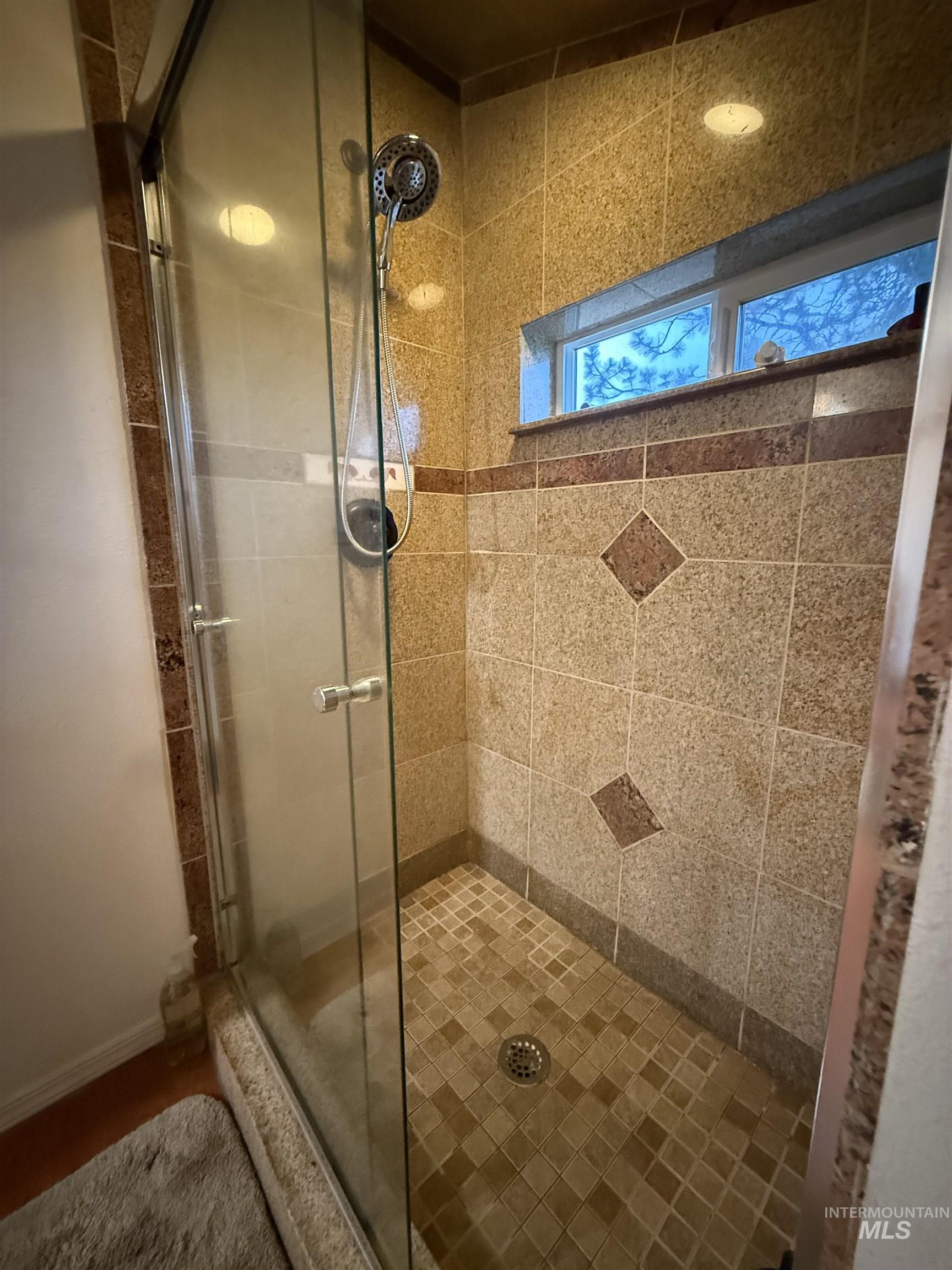 1653 Kidder Ridge Road Kamiah, ID 83536 - Photo 19 of 47 Full bathroom with a stall shower and baseboards