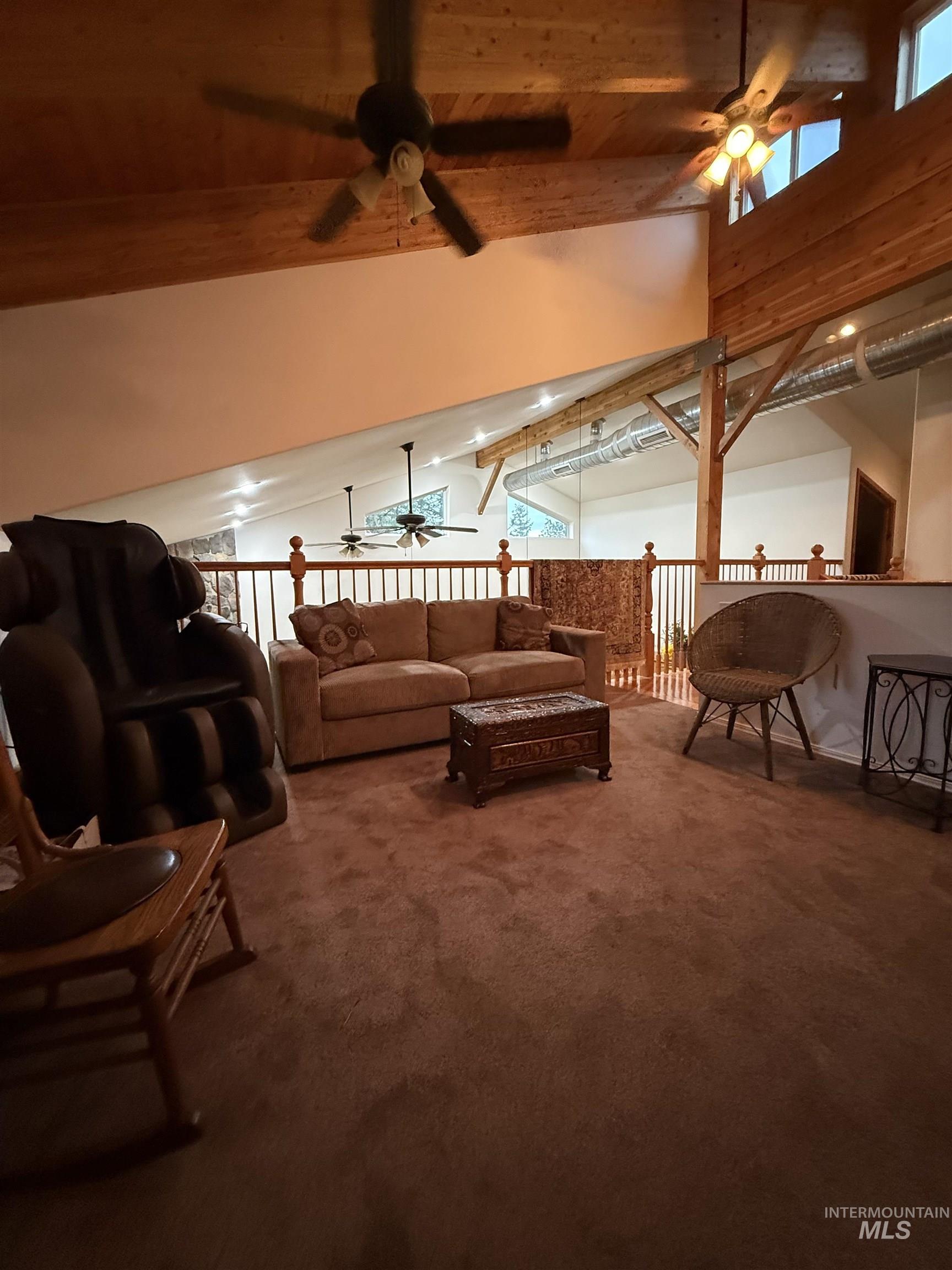 1653 Kidder Ridge Road Kamiah, ID 83536 - Photo 22 of 47 Carpeted living area with ceiling fan and wood ceiling