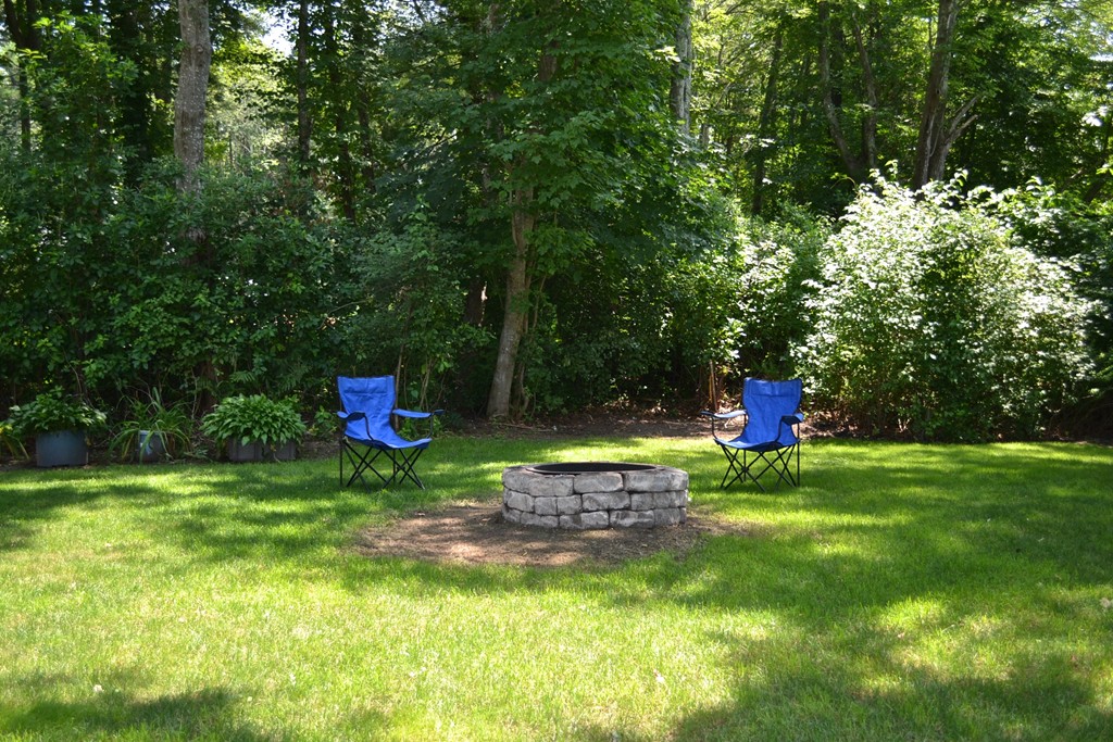 713 Reed Road Dartmouth, MA 02747 - Photo 25 of 28 a backyard of a house with seating space