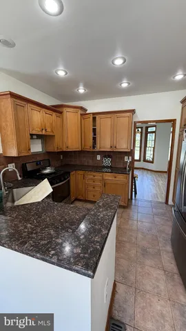 a bed sitting in a room next to a window