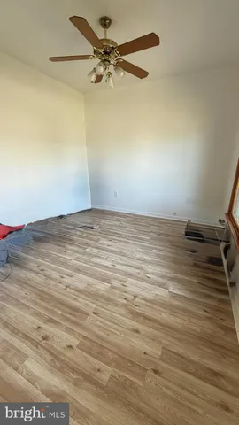 a view of an empty room with windows