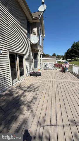a living room with a black white checkered floor