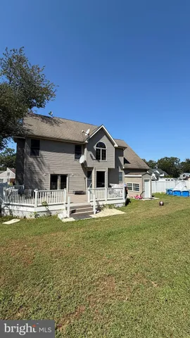 a bath tub sitting in a bathroom next to a window