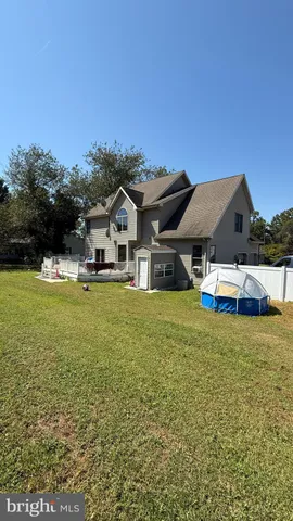a living room with a toilet and a floor to ceiling window