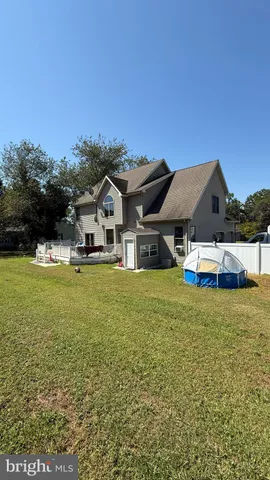 a view of livingroom with hardwood floor and ceiling fan